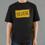 Believe Taped Yellow Paper Sign