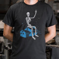 Giant Skeleton Waving from Rooftop of a House
