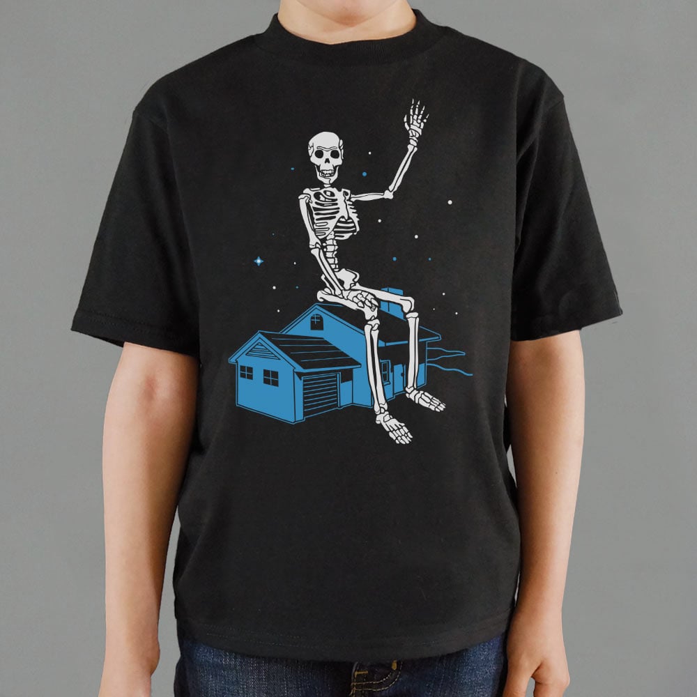 Giant Skeleton Waving from Rooftop of a House